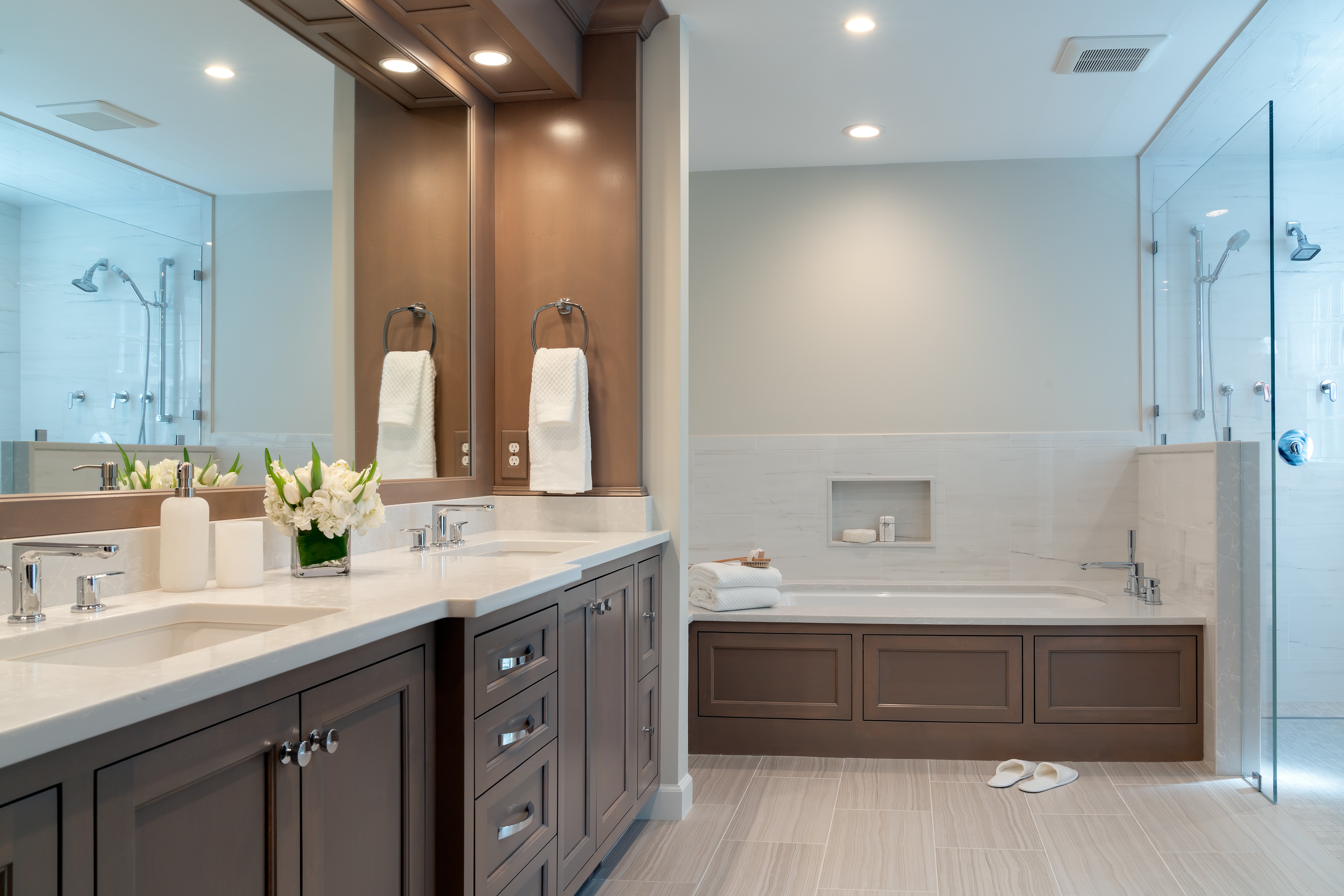 Double vanity remodel with custom storage and modern lighting